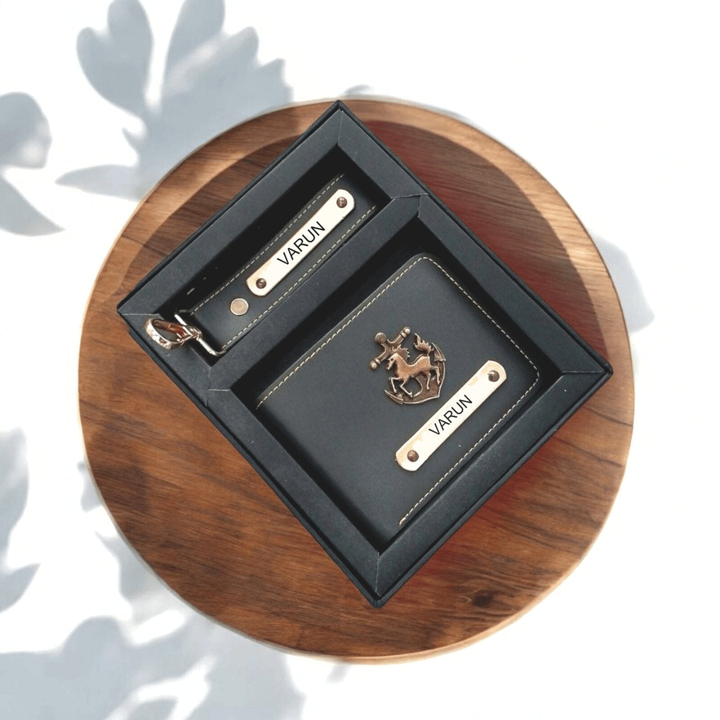 Personalized men's black wallet and keychain gift set with metal nameplates in a box