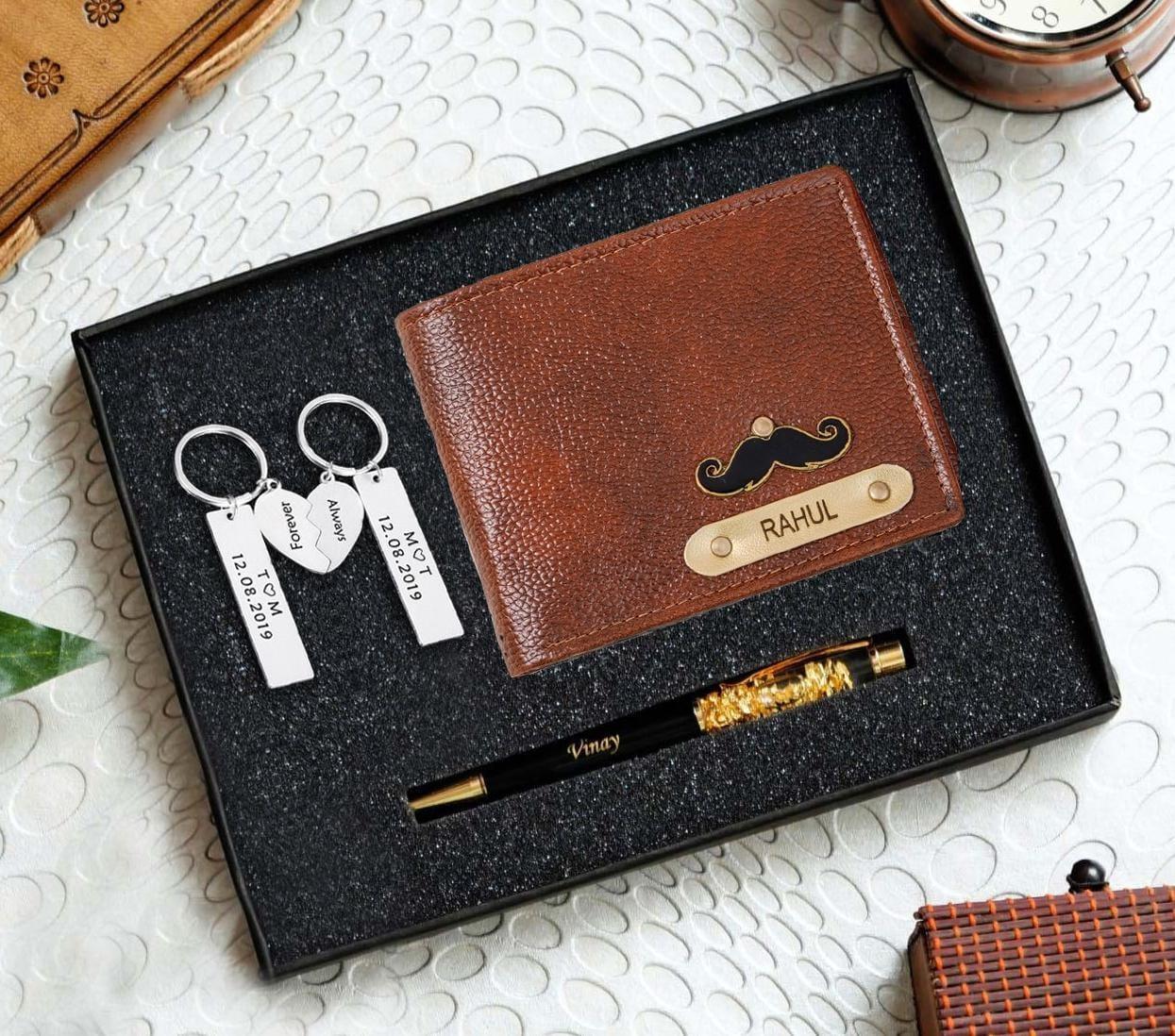 Personalised men's brown wallet with mustache detail, matching engraved pen, and couple keychains gift set.
