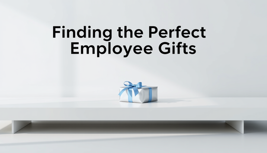 Gift box with blue ribbon on white surface, text reads Finding the Perfect Employee Gifts