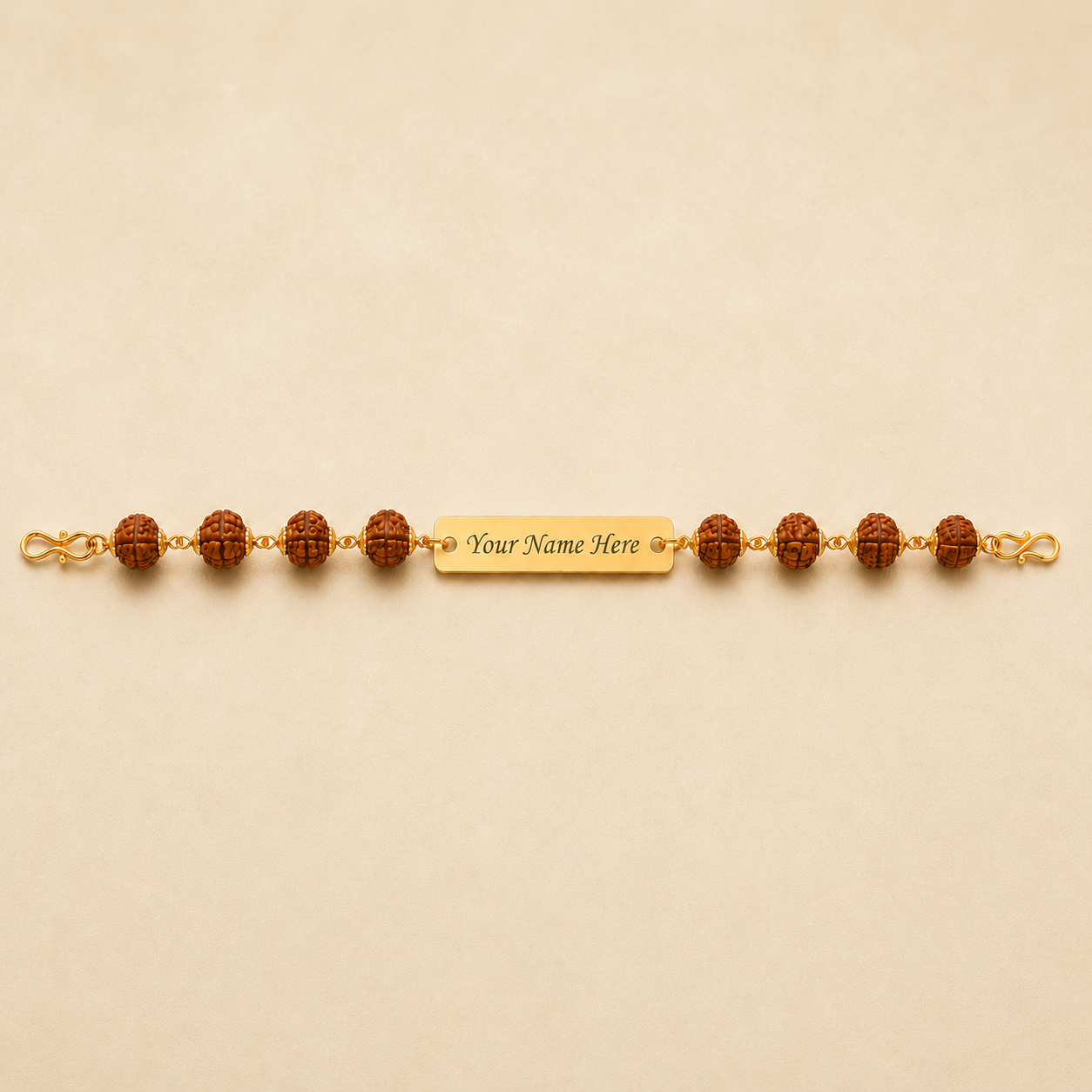 Customizable rudraksha rakhi – gold plate engraved with your brother's name