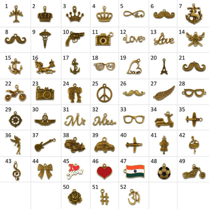 Assorted gold wallet charms including crowns, mustaches, anchors, sunglasses, and heart shapes.