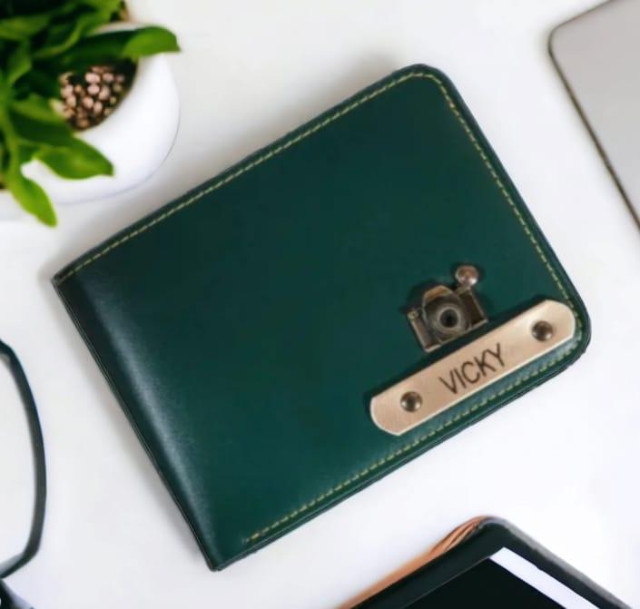Customized green faux leather men's wallet with stitched edges and metal nameplate charm