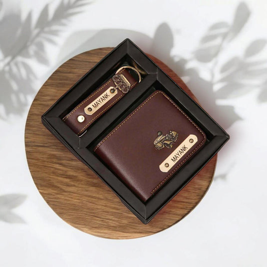 Personalized men’s brown leather wallet and keychain gift set with engraved metal nameplates.
