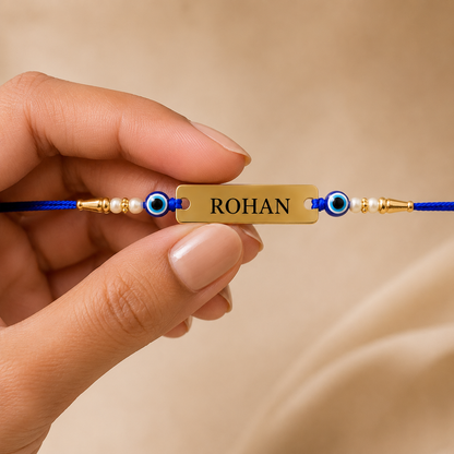 Personalized evil eye name rakhi with custom engraved gold-finish name plate
